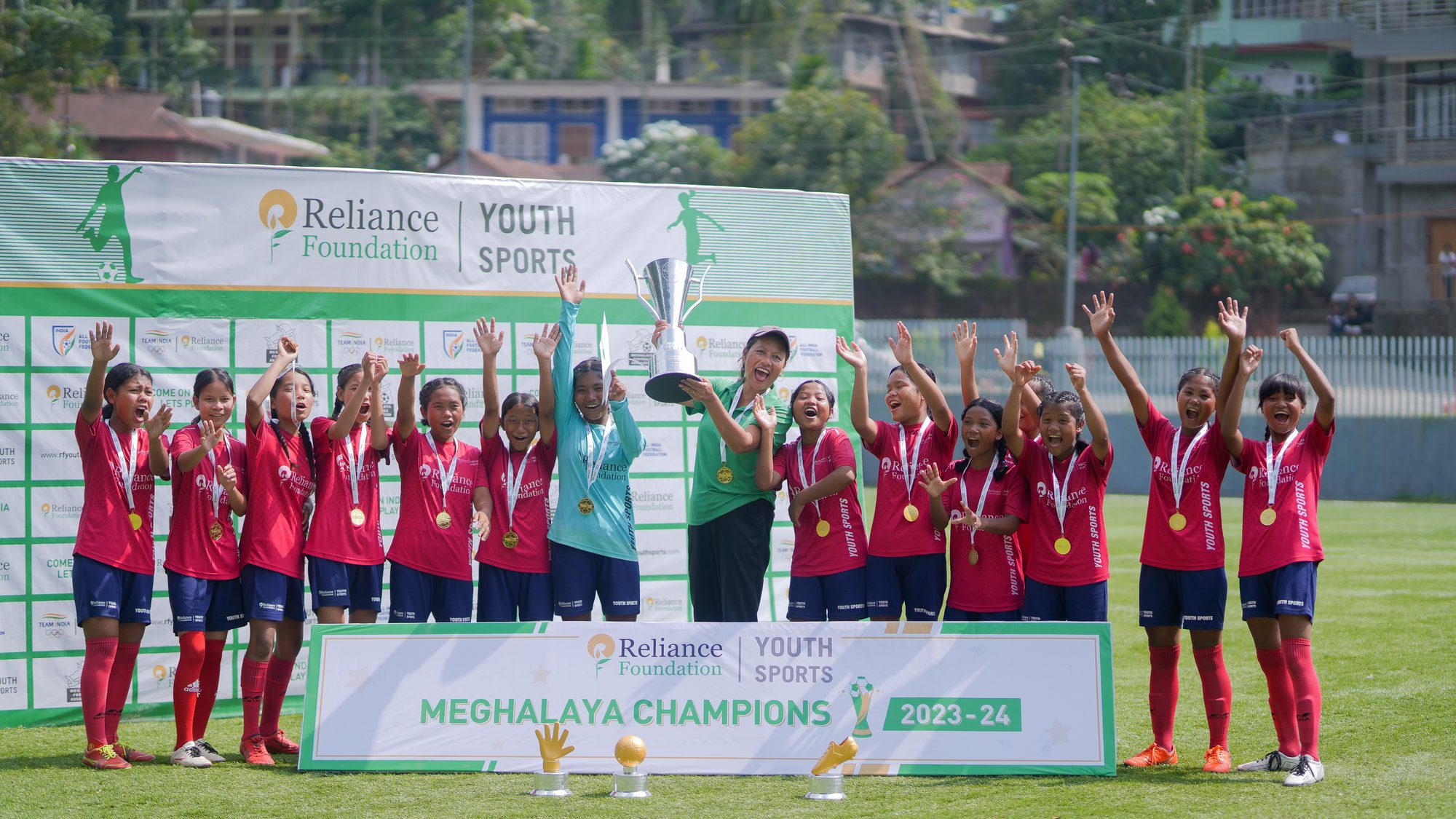RFYS Meghalaya City Champions Girls Under-15 team celebrating with the trophy